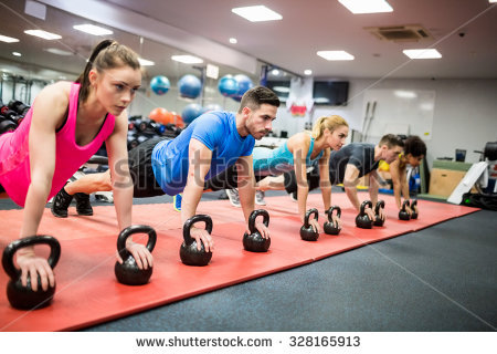 stock-photo-fit-people-working-out-in-fitness-class-at-the-gym-328165913